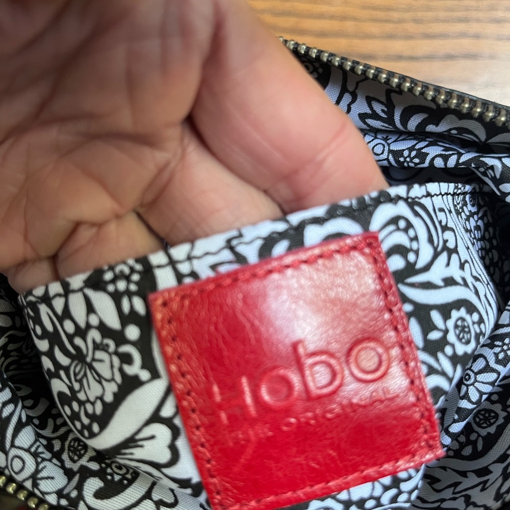 HOBO Crossbody Bag with Black & White Paisley Liner and Red Logo Patch